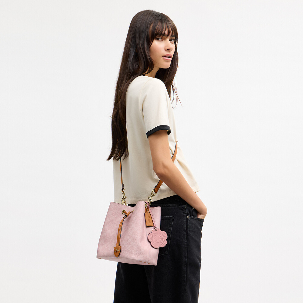 Coach Outlet Rowan Bucket Bag In Signature Canvas With Charms